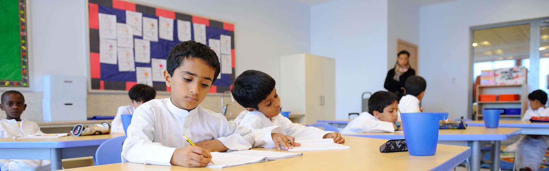 Young kids studying in a classroom in Abu Dhabi