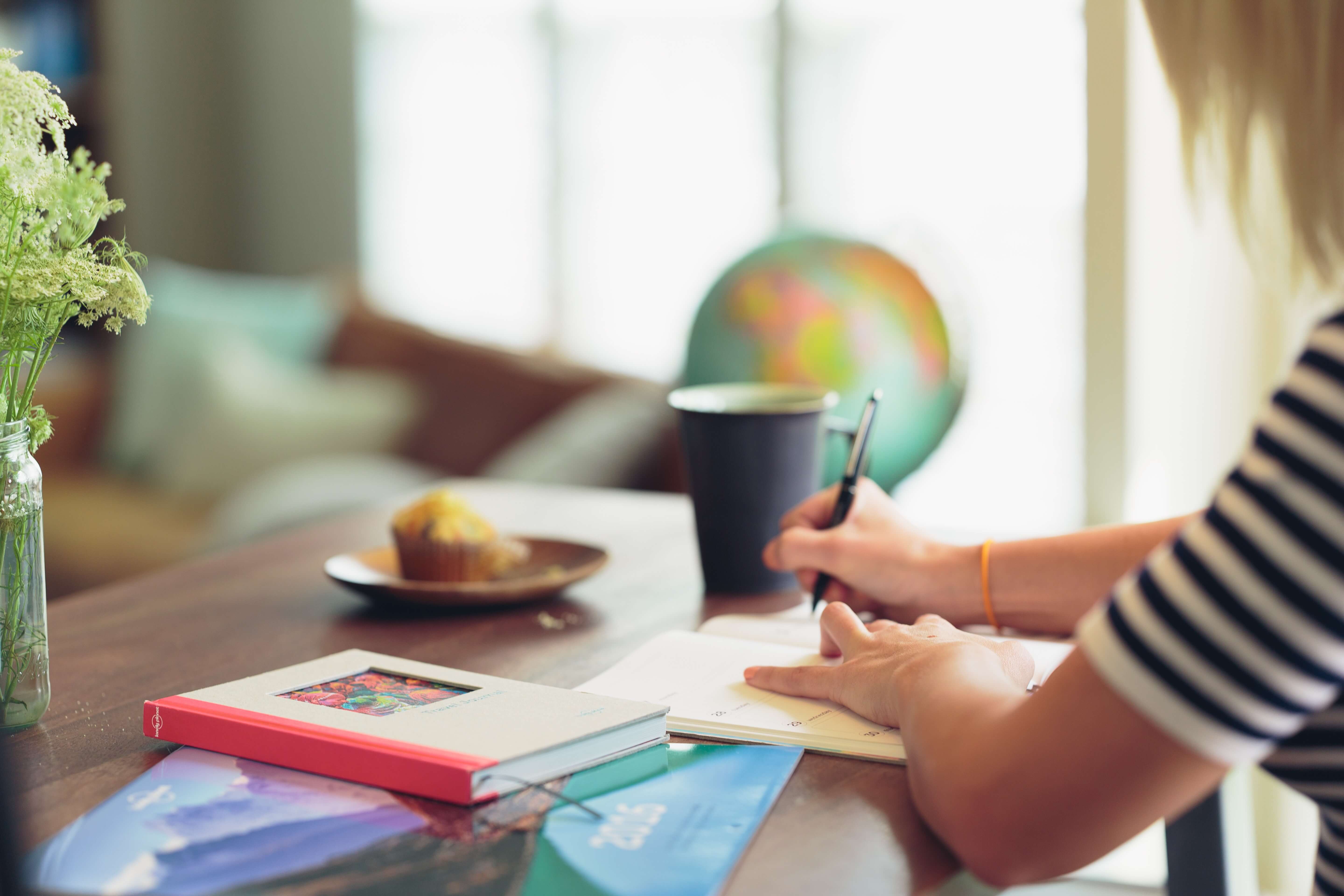 woman writing in a journal